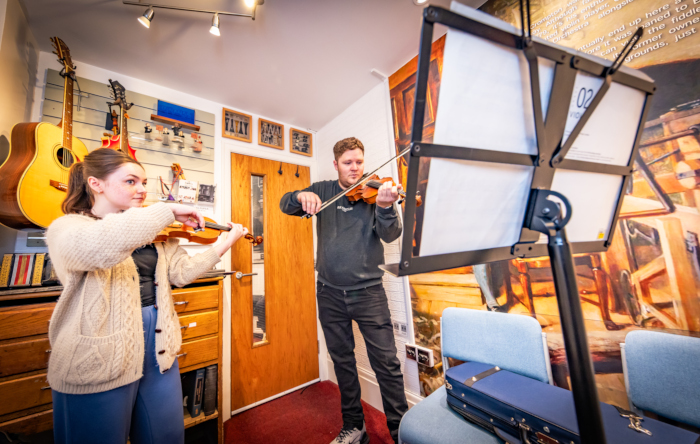 Booths Violin Tutor Rosa Giving a Violin Lesson